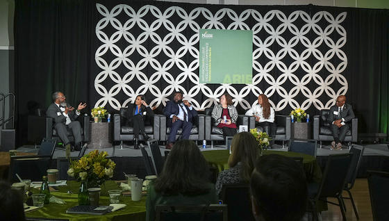 people on stage at conference